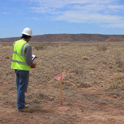 A site evaluator marking a property ahead of the county permit process